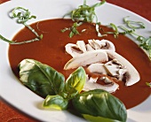 Tomato soup with mushrooms and basil