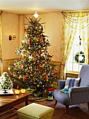 Richly decorated Christmas tree and gifts in living room
