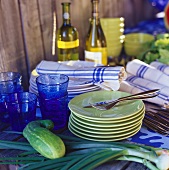 Vegetables, glasses, crockery, cutlery & tea towels in kitchen
