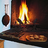 Rustic hearth with open fire (Scandinavia)