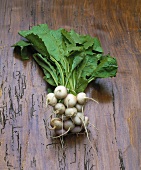 Turnips on wooden background