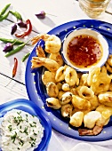 Deep-fried squid and shrimps with chili sauce and tzatziki