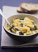 Ribbon pasta with spinach and pine nuts