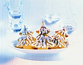 Fir tree biscuits with glacé icing and dragees