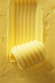 Butter with butter curl (close-up)