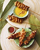 Meat kebabs with peanut sauce and with chili dip (Thailand)