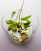 Sprig of basil with olive oil