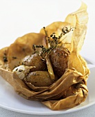 New potatoes in greaseproof paper