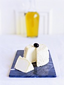 French goat’s cheese (Chabichou du Poitou) with olive