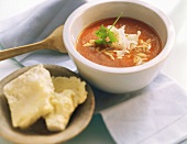 Tomato soup with rice-shaped noodles and Parmesan