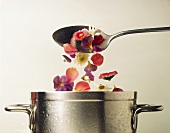 Flowers falling into a pan