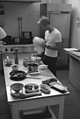 Young man drying a bowl