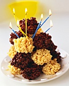 Light and dark rice crispie clusters with burning candles