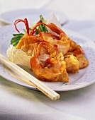 Shrimps in batter on plate with chopsticks