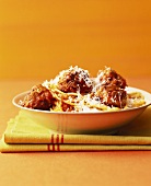 Spaghetti with meatballs, tomato sauce and Parmesan
