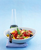 Pasta salad with sausage, cherry tomatoes and olives