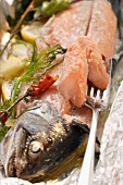 Salmon with herbs steamed in aluminium foil