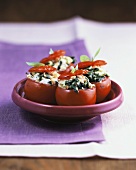 Tomatoes au gratin with spinach and ricotta stuffing