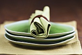 Green plates with green fabric napkin