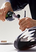 Decanting red wine - transferring wine to a carafe