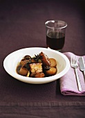 Glazed pork belly with vegetables and mushrooms