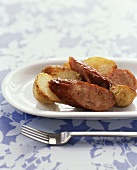 Fried sausage slices with potatoes