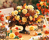 Autumnal arrangement of roses and rose hips
