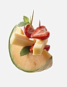 Melon with cheese and strawberries