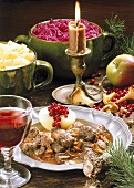 Venison goulash with parsley potatoes and red cabbage