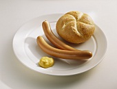 Frankfurters with mustard and bread roll