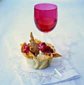 Filo pastry shells with vanilla ice cream and berries