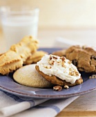 Assorted biscuits and a glass of milk