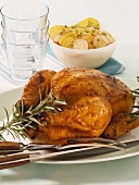 Rosemary chicken cooked on spit