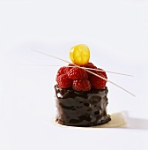 Small chocolate cake with raspberries