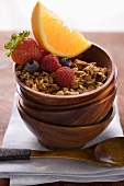 Muesli and fruit in wooden bowl