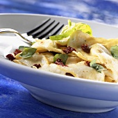 Ravioli with pieces of dried tomato and basil