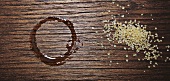 Cup ring and spilt sugar on a wooden table