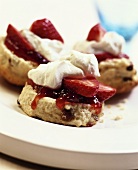 Scones with jam, strawberries and cream