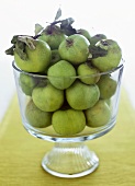 Green apples in glass bowl