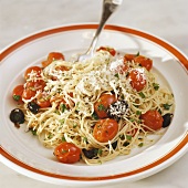 Spaghetti with cocktail tomatoes, olives and Parmesan