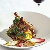 Lamb shank with pesto, vegetables and sage
