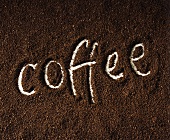 Ground coffee with the word 'coffee'