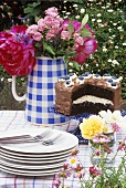 Chocolate cake with blueberries on table in the open air