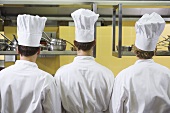 Three chefs from behind