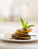 Glazed apple rings with vanilla ice cream and mint