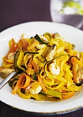 Ribbon pasta with saffron and seafood