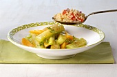 Braised cucumber with oranges and couscous
