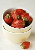 Strawberries in two small bowls, stacked