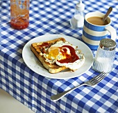 Fried egg on toast with ketchup