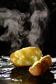 A steaming potato, halved